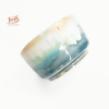Mini coupelle en céramique artisanale Ixèsos, reflets marins bleu-vert et extérieur minéral sable